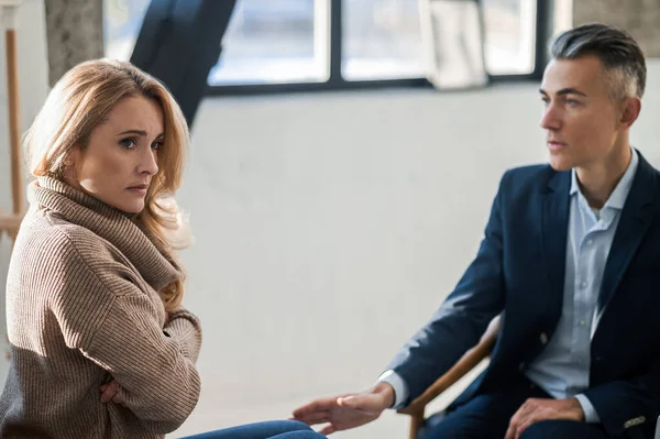 stock image Psychological problems. Blonde woman having an appointment at the mental physician