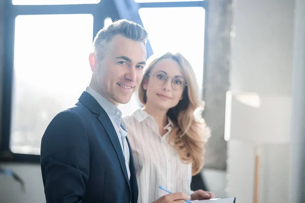 stock image Colleagues. Elegant man and woman working together in the office