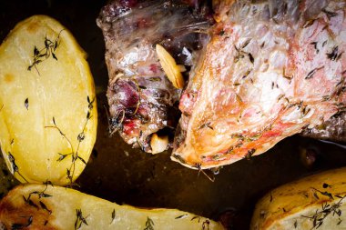 FLANK STEAK beef BBQ food. Meat roasted in a glass dish, with potatoes and thyme.