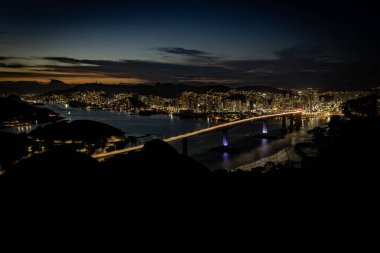 Third Bridge at night seen from Morro do Moreno in the municipality of Vila Velha. Showing light trails from cars.