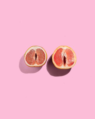 Two Grapefruits on an Orange Background, Vagina Old Age Concept, Health, Vaginal Care Concept, no people