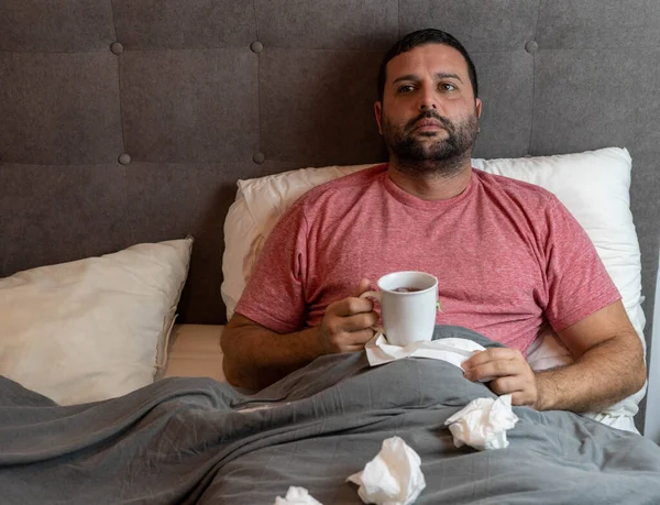 stock image Middle-aged man in bed sick with flu symptoms