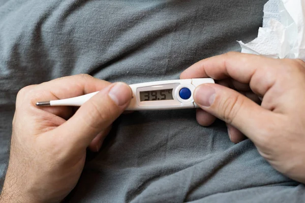 Digital thermometer indicating very high fever