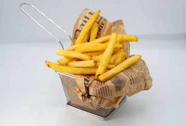 Portion of fried potatoes and sweet potatoes with spicy sauce