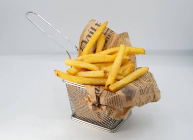 Portion of fried potatoes and sweet potatoes with spicy sauce