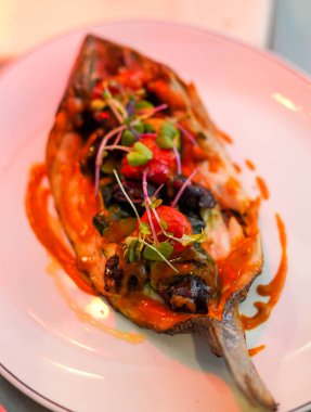 Dish of baked bream with vegetables in a gourmet restaurant