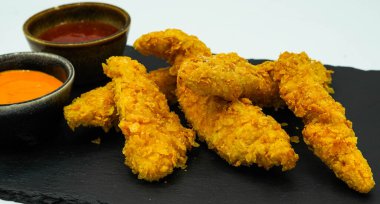 Kentucky-style battered chicken strips with barbecue sauce