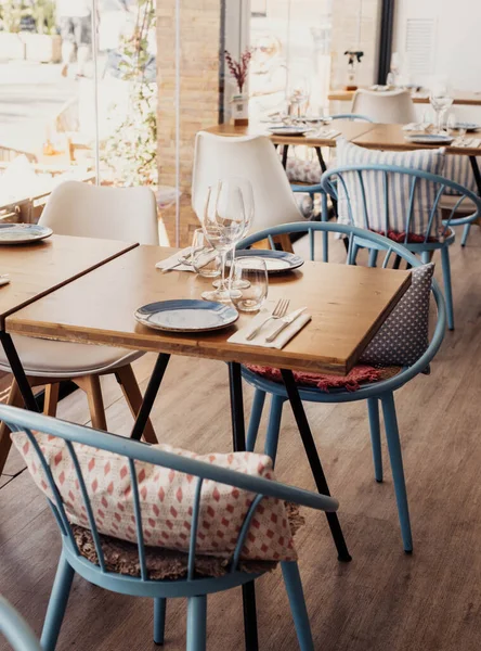 Stock image Table and chairs with plates, napkins and glasses in a fine coastal restaurant