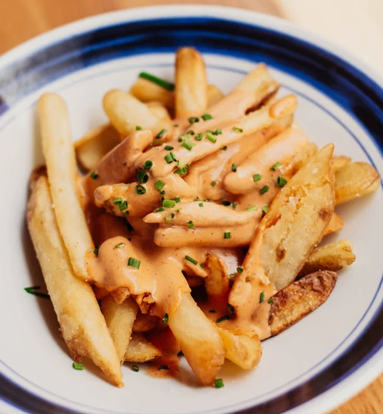 stock image French fries with American style cheddar cheese