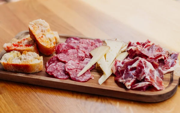 stock image Table of Iberian sausages and Manchego cheeses