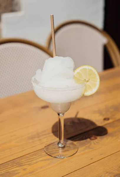 A classic margarita cocktail with tequila and frozen lemon
