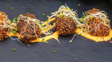 Portion of gourmet chicken, seafood and ham croquettes