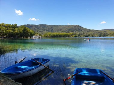 Turquoise lake Banyoles with boats, Spain clipart
