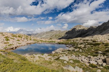 Estany del Cap dels Pessons, lake de Pessons in the Pyrenees mountains of Andorra, summertime clipart