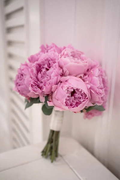 Pink wedding bouquet of peony. Sarah Bernhardt peonies.