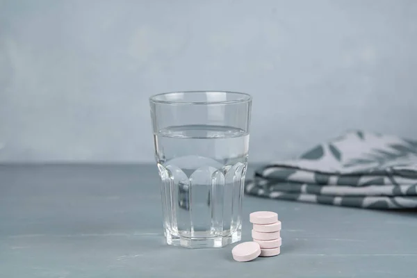 Vitamin c effervescent tablet and glass of water. Health and medical concept.