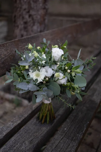 Beauty wedding bouquet. Green bridal bouquet composed of roses, hypericum, scabiosa and greenery.