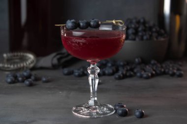 Fresh berries cocktail with bluenerries. Summer cold drink and cocktail on dark background.