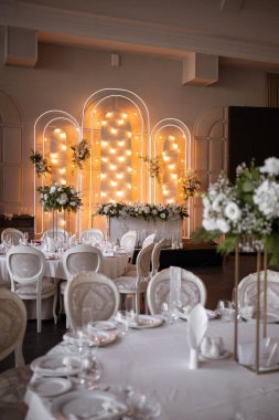 Luxury wedding table setting with flower centerpieces and candles. Wedding day.