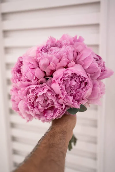 Pink wedding bouquet of peony. Sarah Bernhardt peonies.