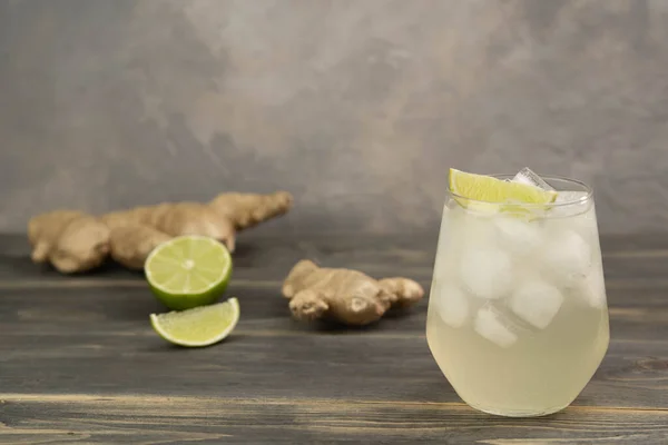 stock image Fresh cocktail prepared with ginger beer, lime and ice. Beverage on the table. Image contains copy space for text.