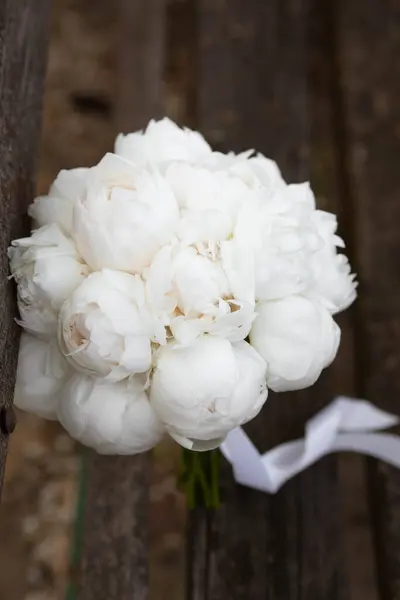 White wedding bouquet of peonies. Wedding floristic. Wedding day.