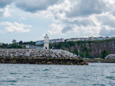 Brixham, Torbay, Devon, South West, England, United Kingdom, 07.19.2023. Brixham Harbour Lighthouse. View of the breakwater and lighthouse clipart