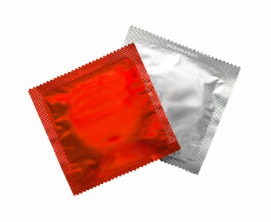 Red condom packet isolated on white background