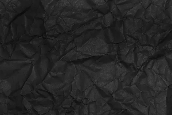 黑色折皱纸纹理为背景 — 图库照片