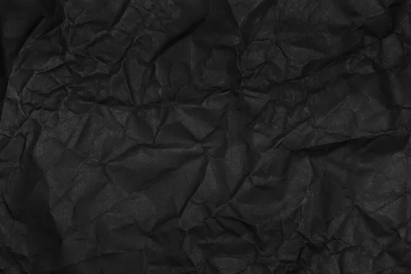 黑色折皱纸纹理为背景 — 图库照片
