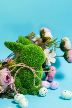 Easter bunny and eggs on blue background. Celebration layout or card.. High quality photo