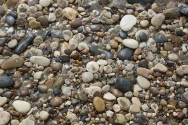 Sahildeki deniz taşlarının arka planı