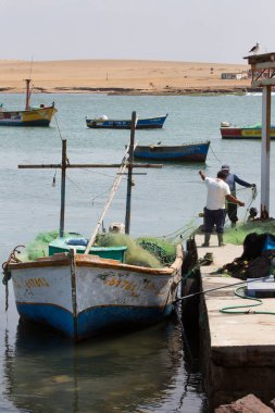 Peru - December, 2023: Fishing boats near small fishing village of Lagunillas, Peru  clipart