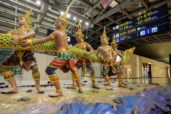 stock image Bangkok, Thailand - November 27, 2022: Churning of the Ocean of Milk statue at Suvarnabhumi Airport departure lounge in Bangkok, Thailand. Churning of the ocean of milk, in Hinduism, one of the central events in the ever-continuing struggle between t