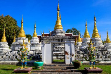 Lampang, Thailand - December 2, 2023: Wat Phra Chedi Sao Lang is a Buddhist temple in Lampang, Thailand. The temple is located approximately 1.5 kilometres north of Lampang, and is noted for its series of 20 chedi arranged in a courtyard. 