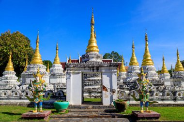 Lampang, Thailand - December 2, 2023: Wat Phra Chedi Sao Lang is a Buddhist temple in Lampang, Thailand. The temple is located approximately 1.5 kilometres north of Lampang, and is noted for its series of 20 chedi arranged in a courtyard. 