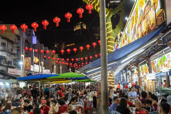 stock image Kuala Lumpur, Malaysia - February 9, 2024: A crowded street scene of Jalan Alor a street food night market located in the Bukit Bintang area of Kuala Lumpur, Malaysia. 