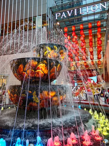 stock image Kuala Lumpur, Malaysia - February 12, 2024: Entrance view of Chinese New Year decorations with red lanterns and fountain in Pavilion shopping center a luxury shopping mall located in Kuala Lumpur, Malaysia.