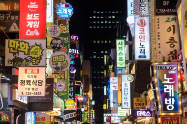 Seoul, South Korea - October 28, 2024: Illuminated street bar signs at night in the nightlife entertainment district of Jongno-Gu located in Seoul, South Korea. clipart