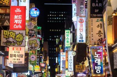 Seoul, South Korea - October 28, 2024: Illuminated street bar signs at night in the nightlife entertainment district of Jongno-Gu located in Seoul, South Korea. clipart