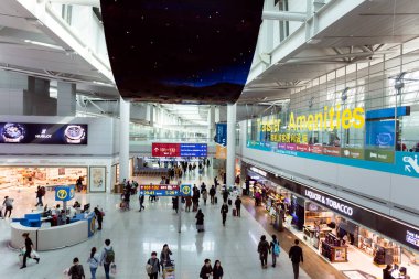 Seoul, Korea - March 15, 2017: Interior of the transit lounge and duty free shops at Incheon International Airport the largest airport in South Korea.  clipart