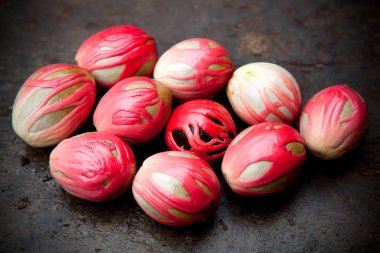 Assortment of organic mace aril and nutmeg seed. Mace is the spice made from the reddish seed covering called an aril of the nutmeg seed. Its flavour is similar to that of nutmeg but more delicate; clipart