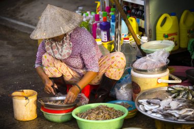 Duong Dong, Phu Quoc Island, Vietnam - January 25, 2018: Vietnamese market vendors selling fresh seafood at the Duong Dong Market located in Duong Dong, Phu Quoc Island, Vietnam.