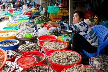 Duong Dong, Phu Quoc Island, Vietnam - January 25, 2018: Vietnamese market vendors selling fresh seafood at the Duong Dong Market located in Duong Dong, Phu Quoc Island, Vietnam.