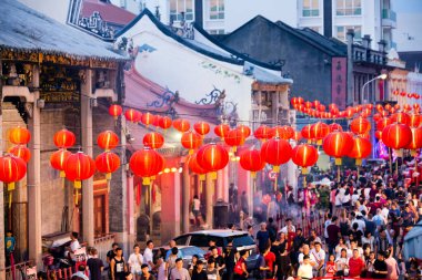 Georgetown, Penang, Malaysia - February 3, 2017: Crowded street scene of locals and tourists celebrating the Chinese New Year and The Year of the Rooster in Georgetown, Penang, Malaysia.  clipart