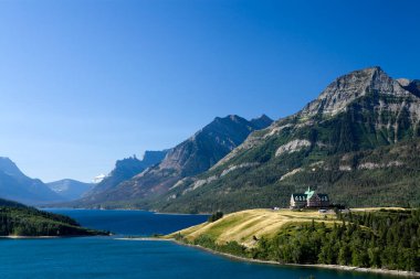 Waterton Lakes National Park is in southern Alberta, Canada, bordering Montanas National Park. Its known for its chain of lakes, including the large Upper and Middle Waterton lakes, flanked by the Rocky Mountains. clipart