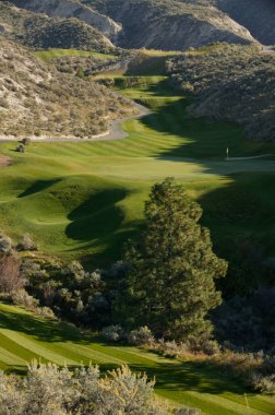 Kamloops, Canada - October 2, 2004: Landscape view of a golf course formally known as Sun Rivers Golf, and now Bighorn Golf & Country Club is located in Kamloops, British Columbia, Canada clipart