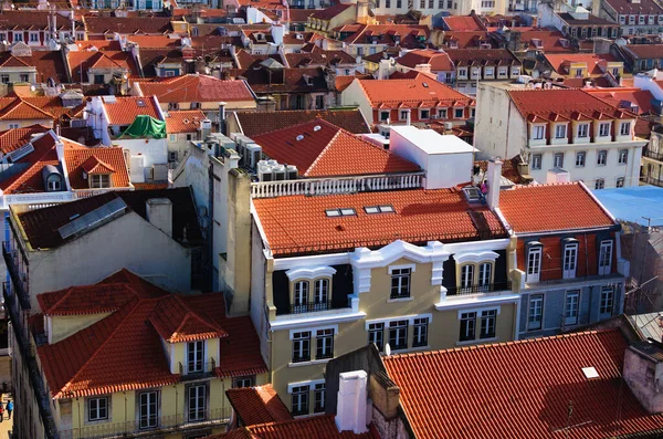 Detailed landscape view of ancient red tile roof buildings in city center of Lisbon. View from top of Santa Justa Lift. Sunny day.