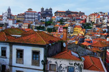 Close-up view of traditional ancient colorful buildings with red tile roofs in Ribeira district in Porto old town. Travel and tourism concept. UNESCO World Heritage Site.