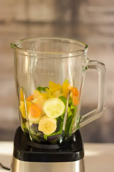 blender for vegetable smoothie with fresh fruits, vegetables and fruit. healthy food